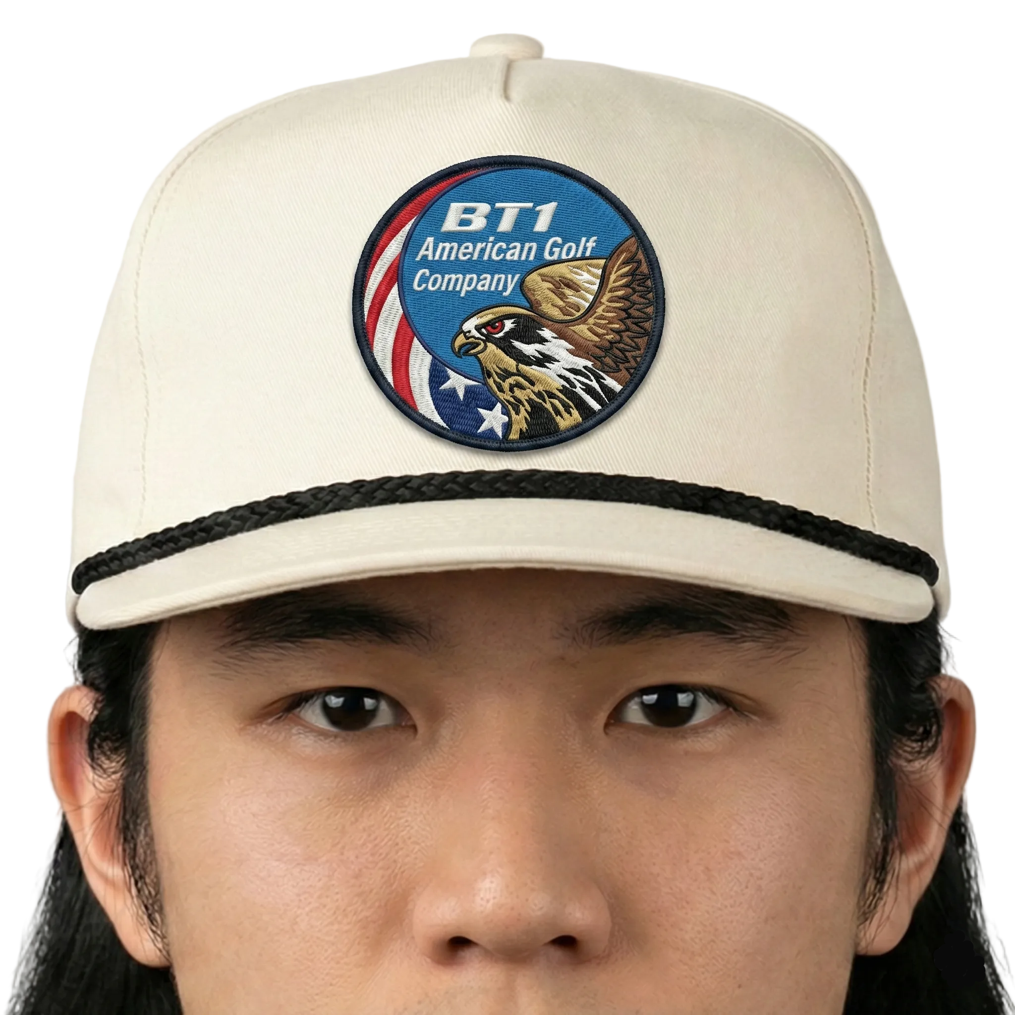 Beige cap with a logo featuring an eagle and text on a white background