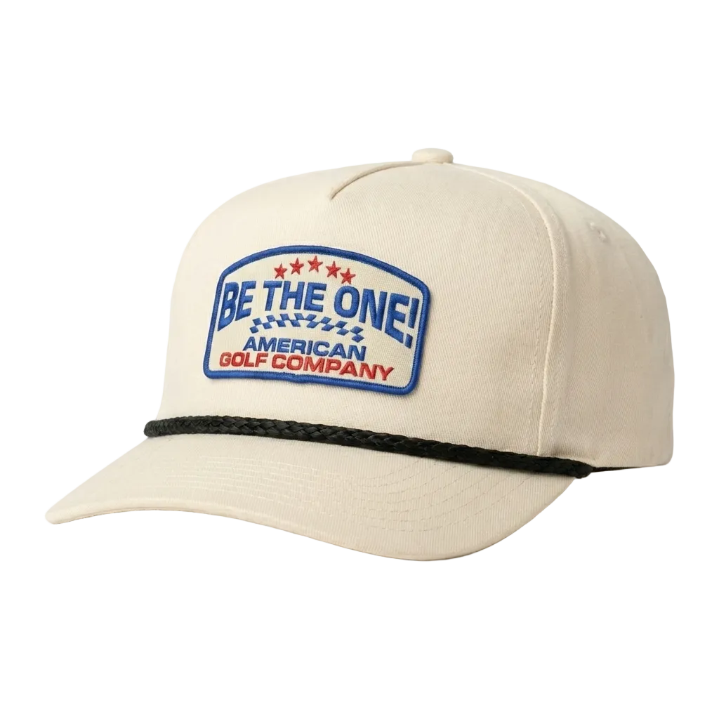 Beige cap with 'Be the One! American Golf Company' logo on a white background